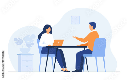 Job interview conversation. HR manager and employee candidate meeting and talking. Man and woman sitting at table and discussing career. Business or human resource concept photo