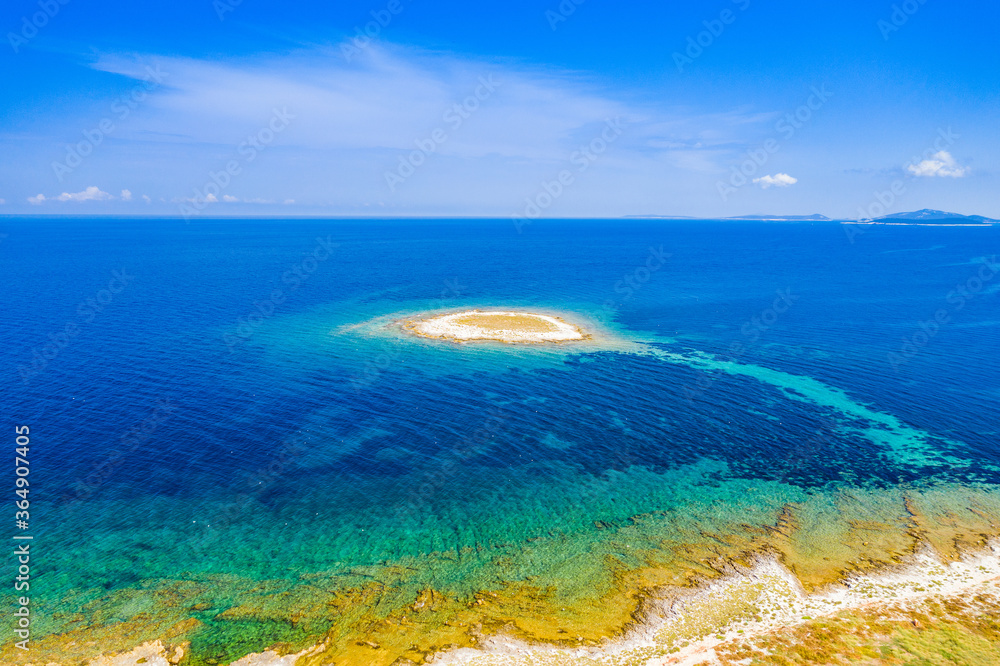 Adriatic coastline in Croatia, beautiful small island of Mali Lagan in turquoise sea in Dugi Otok archipelago, aerial view of from drone
