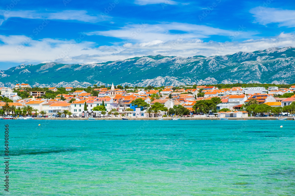 Croatia, town of Novalja on the island of Pag, marina and turquoise sea in foreground, tourist destination on Adriatic sea