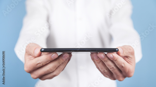 Man holding smartphone. Technology concept