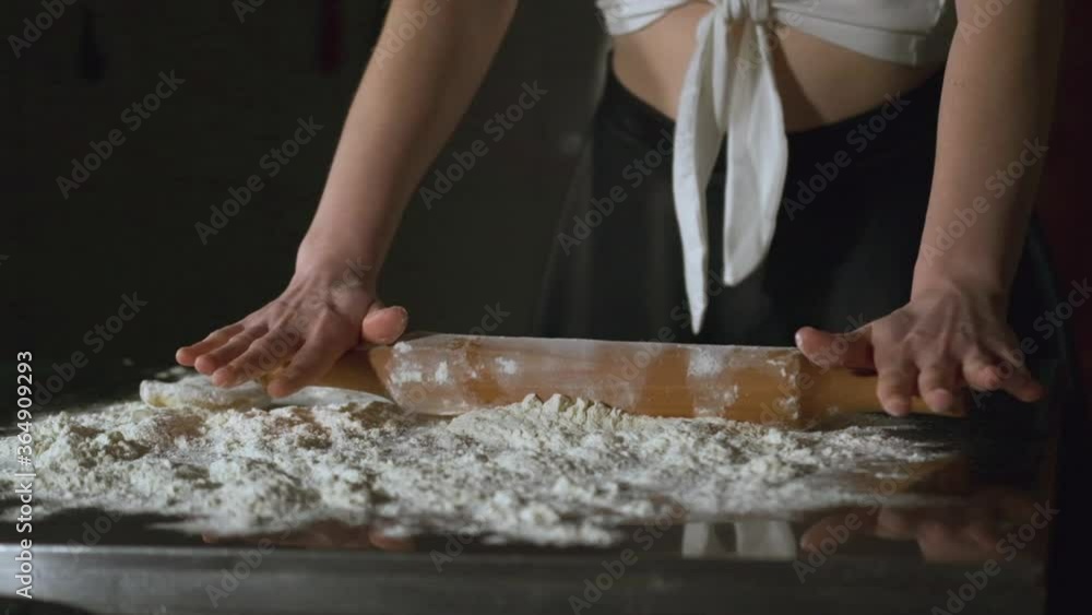 Attractive adult woman making chebureks - Georgian national dish. Process of making food, cooking at the kitchen. Raw cheburek. Attractive adult woman making chebureks - Georgian national dish. Process of making food, cooking at the kitchen. Raw cheburek.