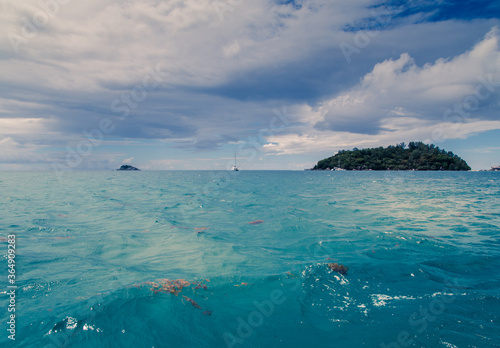 Tropical and heavenly nature view, clouds approaching towards the sea at seychelles islands