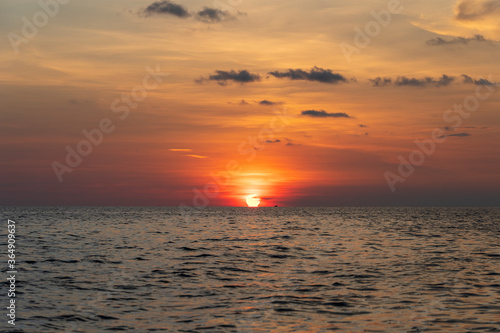 Sunset on the island of Phu Quoc, Vietnam. Travel and nature concept. Evening sky, clouds, sun and sea water © OlegD