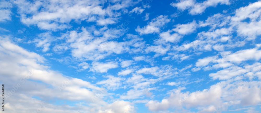 Blue sky background with clouds. Wide photo Blue sky background with clouds. Wide photo
