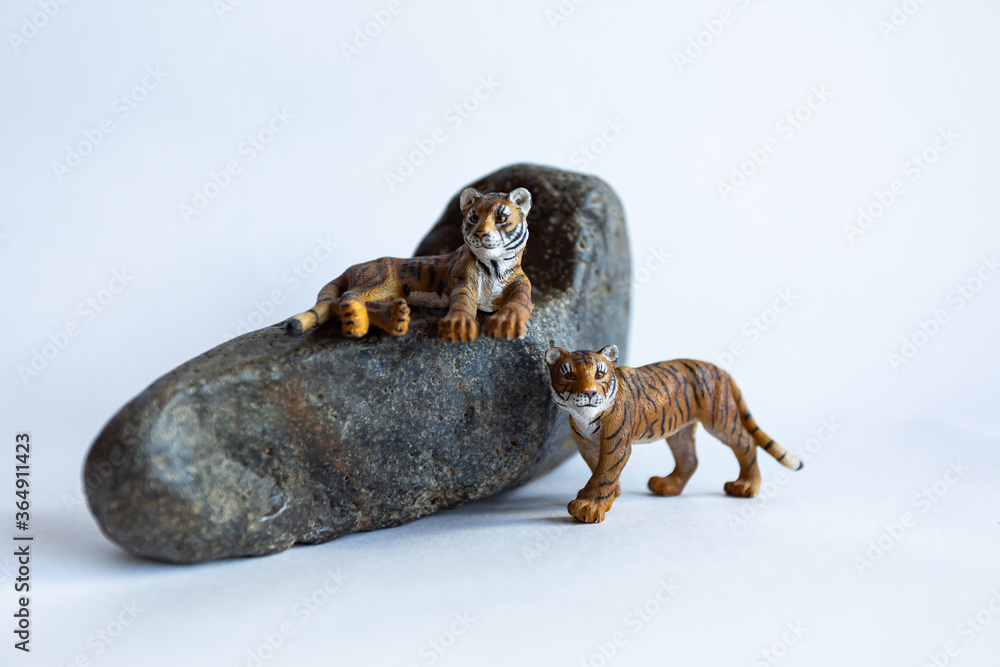 Toy tiger cubs on a white background