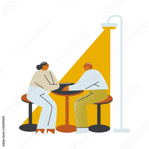 Young couple or friends sitting and talking on open veranda of cafe