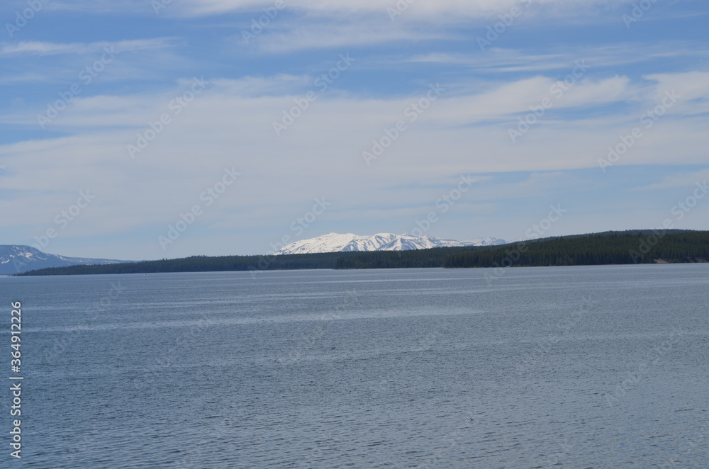 Late Spring in Yellowstone National Park: Looking Across Yellowstone Lake to Gull Point and Sand Point with Mount Sheridan of the Red Mountains Beyond