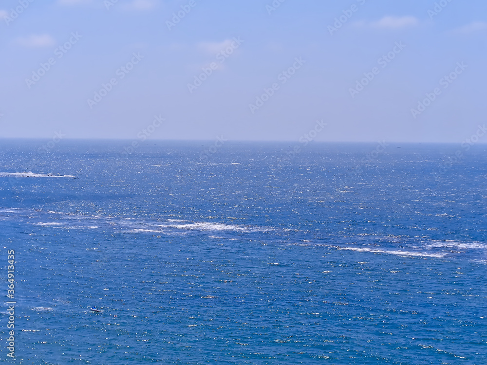 The mediterranean sea at Alexandria, Egypt. Background is a clear blue sky.