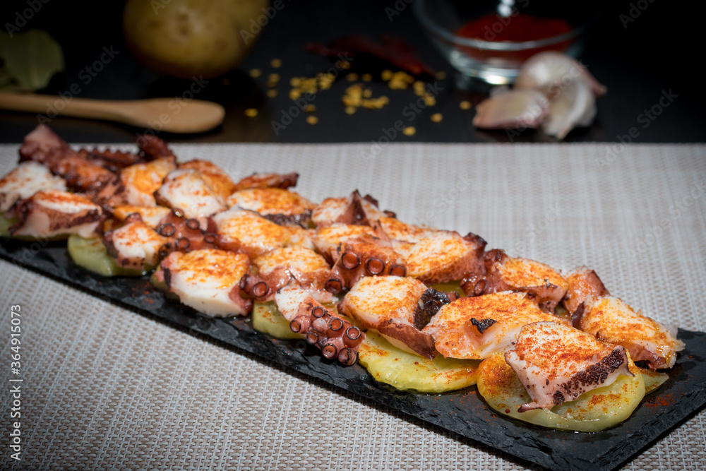 octopus board on cooked potatoes