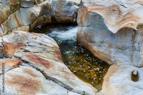 Pool and rocks eroded by the passage of water in the Truchillas River. Sierra de la Cabrera, León, Spain. photo