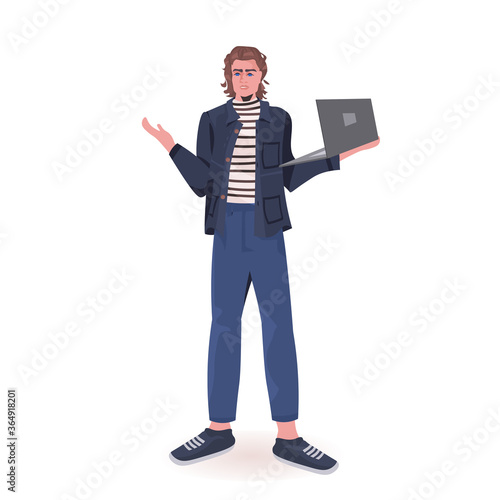man holding laptop guy model in trendy clothes male cartoon character standing pose full length isolated vector illustration