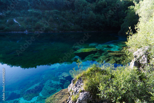 The emerald waters of Lake Cornino in the Cornino regional nature reserve, Italy © Stefano