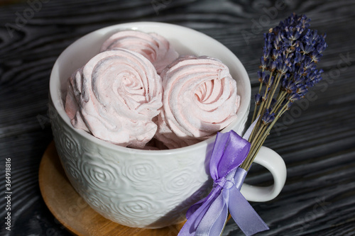 Wallpaper Mural Homemade zephyr in a mug. Near a bunch of lavender. On the surface of pine boards painted in black and white. Torontodigital.ca
