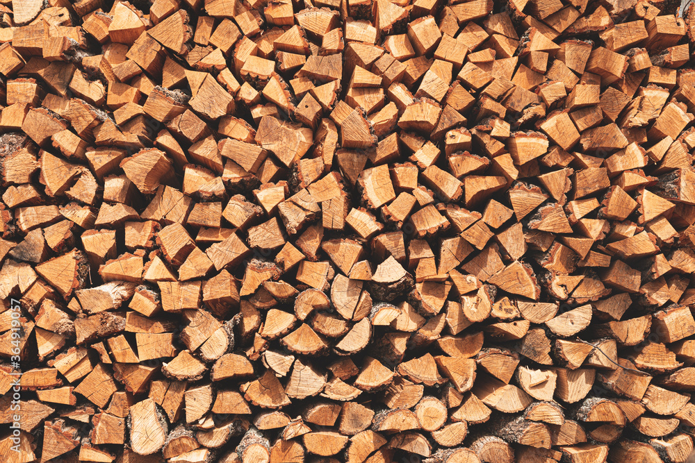 Oak chopped firewood stacked to form a texture Oak chopped firewood stacked to form a texture