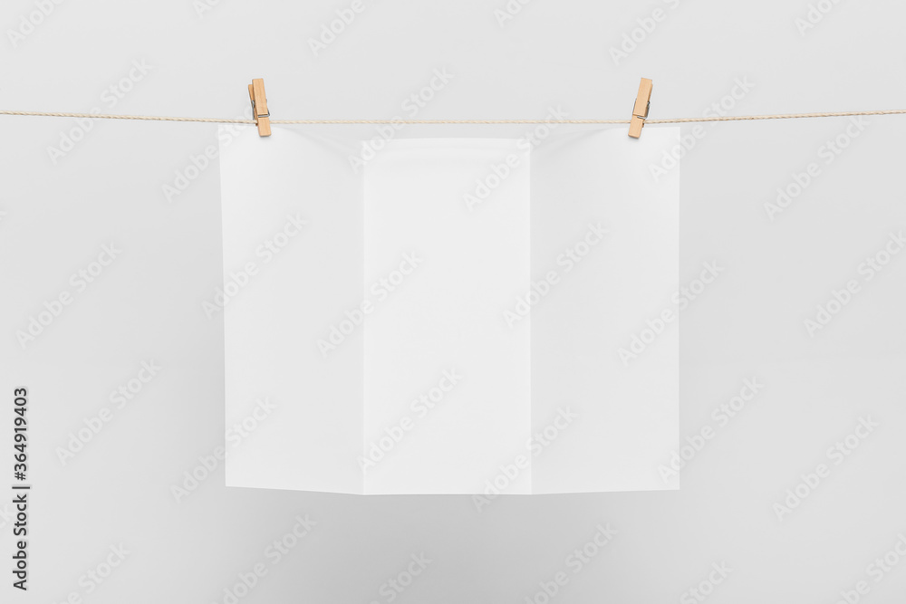 Blank Card Hanging on a Clothesline against White Blank Card Hanging on a Clothesline against White