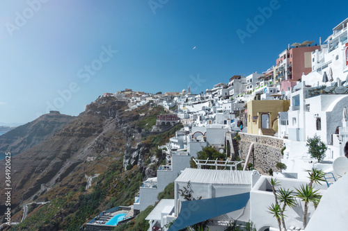 Amazing city of Thira and the white small houses leaning on the Cliffs, Santorini, Greece. 