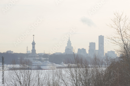 Северный речной вокзал на фоне современных зданий зимой, Москва           Northern river station on the background of modern buildings in winter, Moscow