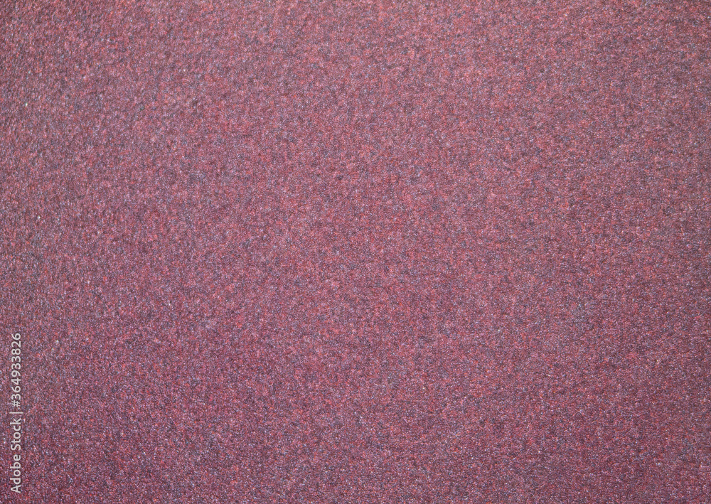 Fototapeta premium Fine emery paper texture. In a red purple version.