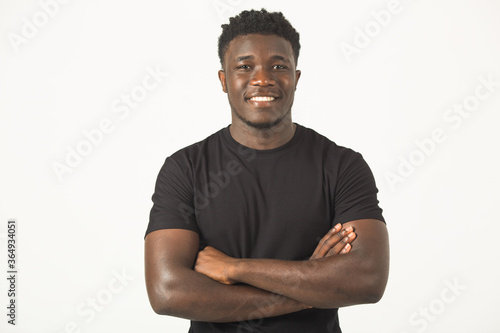handsome young african male in black t-shirt on white background with a smile