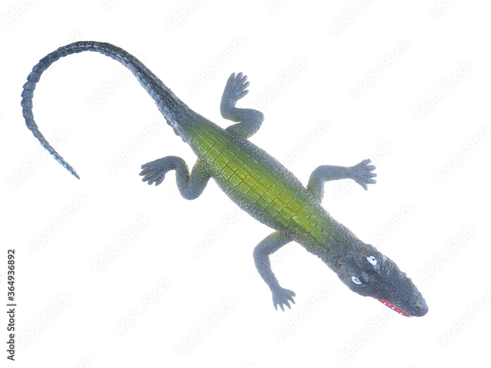 Naklejka premium toy crocodile on a white background