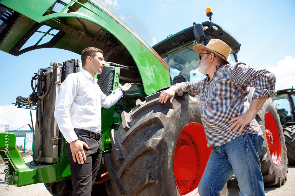 custom made wallpaper toronto digitalProfessional farmer with a modern tractor, combine at a field in sunlight at work. Confident, bright summer colors. Agriculture, exhibition, machinery, plant production. Senior man on his machine with