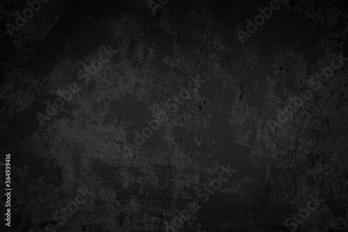 Art black concrete stone texture for background in black. Abstract color dry scratched surface wall cover colorful paper scratches shabby vintage Cement and sand grey dark detail covering. photo