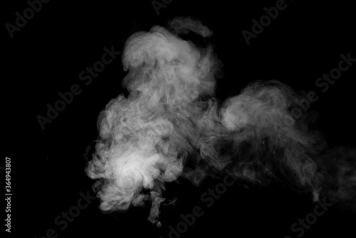 White smoke or steam on a black background.