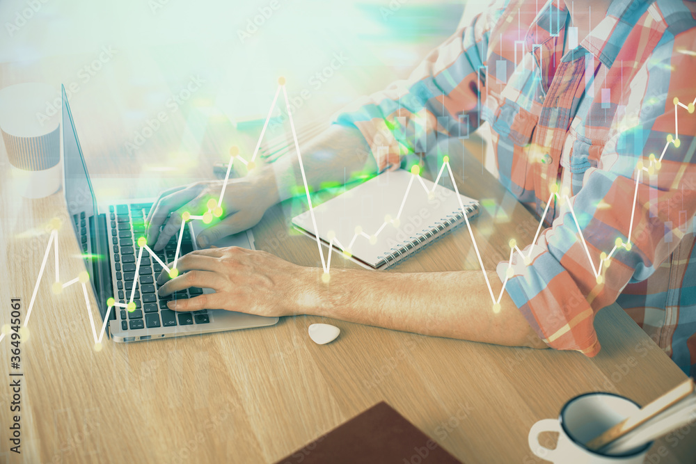 Multi exposure of forex graph with man working on computer on background. Concept of market analysis.