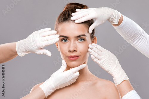 Attractive young woman getting treatment at beauty clinic