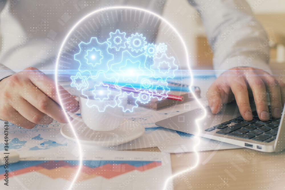 Businessman with computer background with brain theme hologram. Concept of brainstorm. Multi exposure. Businessman with computer background with brain theme hologram. Concept of brainstorm. Multi exposure.