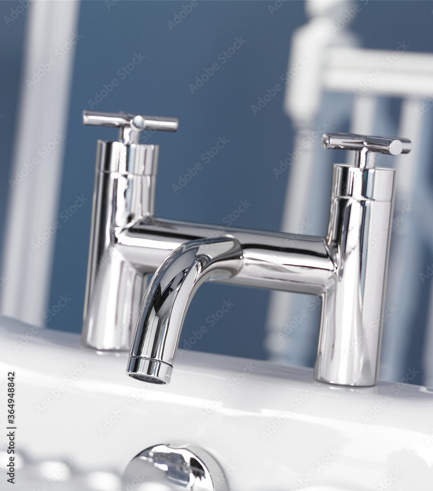 Chrome finish faucet set on bathtub