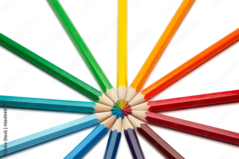 A lot of colorful wooden pencils on a white background A lot of colorful wooden pencils on a white background