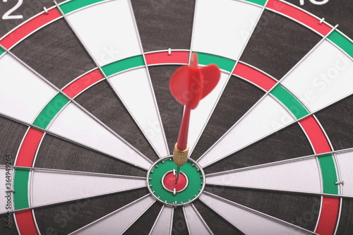 Aiming at the target, marketing, advertising and business concept. Darts game.