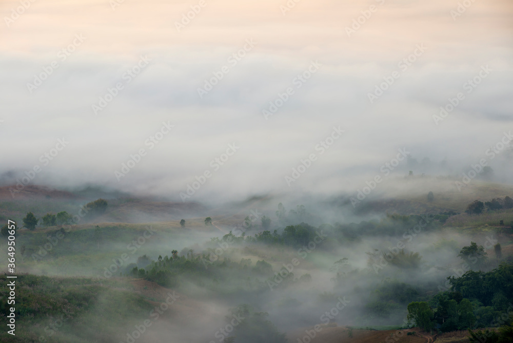 Beautiful landscape of mountain misty morning sunrise is the travel destination and famous place at Khao Kho district, Phetchabun province, Thailand. Relaxation with the natural