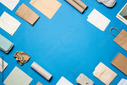 Different used papers arranged on a blue background