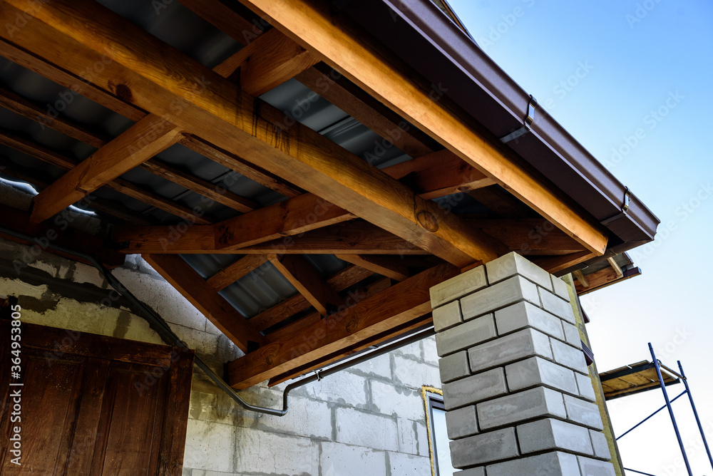 Obraz premium Construction of a pitched roof. Sheathing of metal roof. Roof slope.