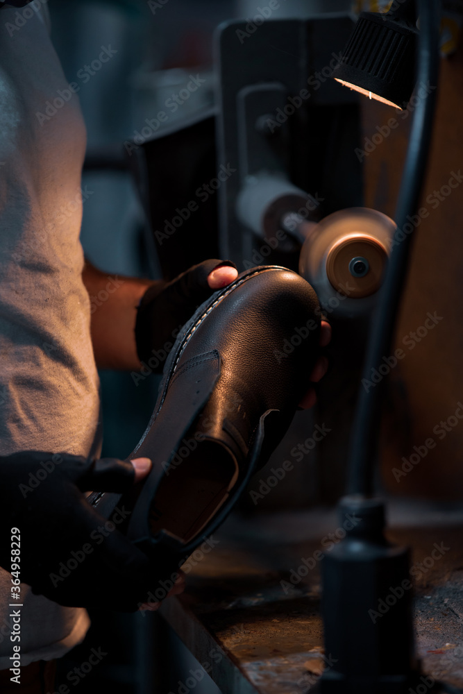 Shoe making process in footwear factory. Shoe making process in footwear factory.