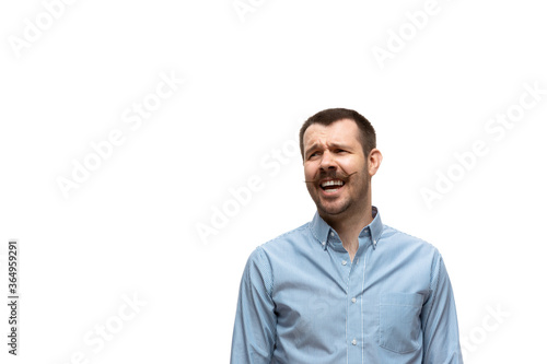 Laughting. Young caucasian man with funny, unusual popular emotions and gestures isolated on white studio background. Human emotions, facial expression, sales, ad concept. Trendy look inspired by