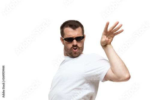 Salt bae. Young caucasian man with funny, unusual popular emotions and gestures isolated on white studio background. Human emotions, facial expression, sales, ad concept. Trendy look inspired by memes