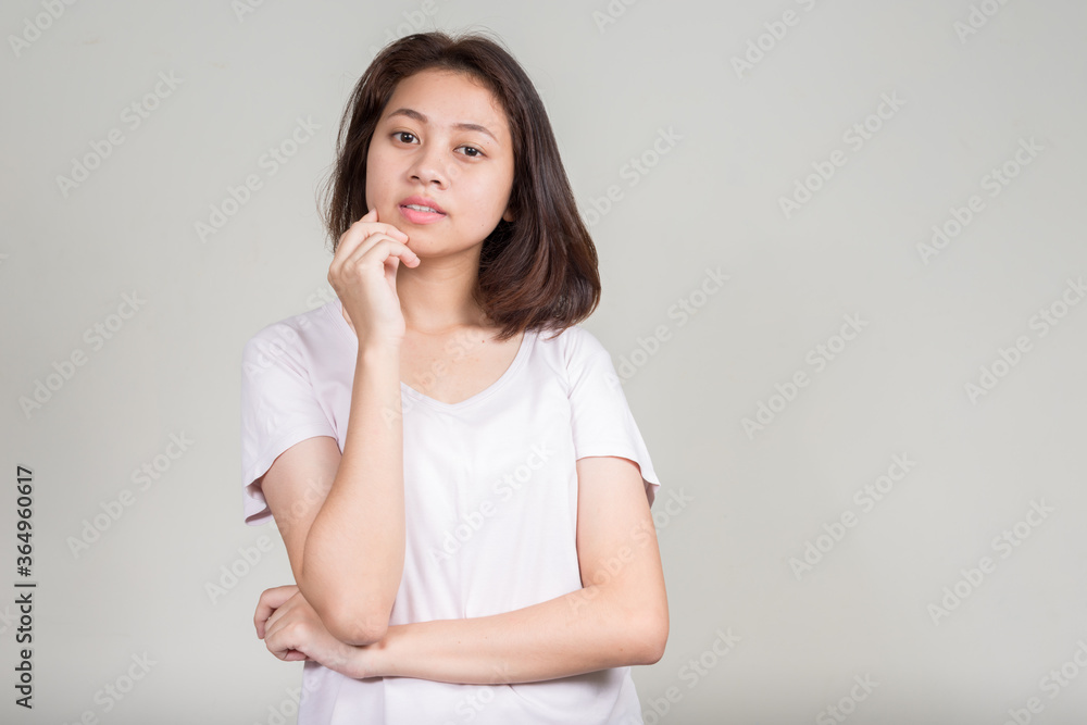 Portrait of young beautiful Asian teenage girl with short hair Portrait of young beautiful Asian teenage girl with short hair