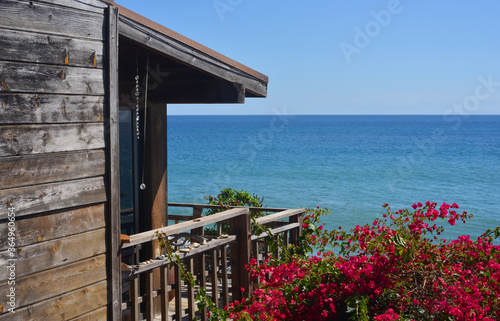 Wooden house with pacific ocean view in california photo