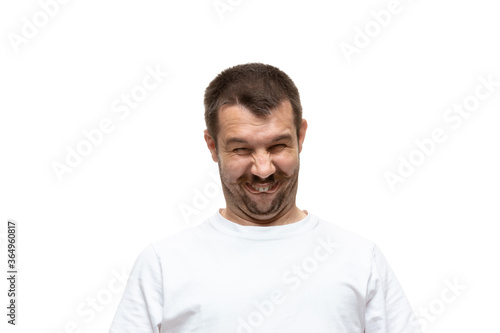 Know what I mean. Young man with funny, unusual popular emotions and gestures isolated on white studio background. Human emotions, facial expression, sales, ad concept. Trendy look inspired by memes.