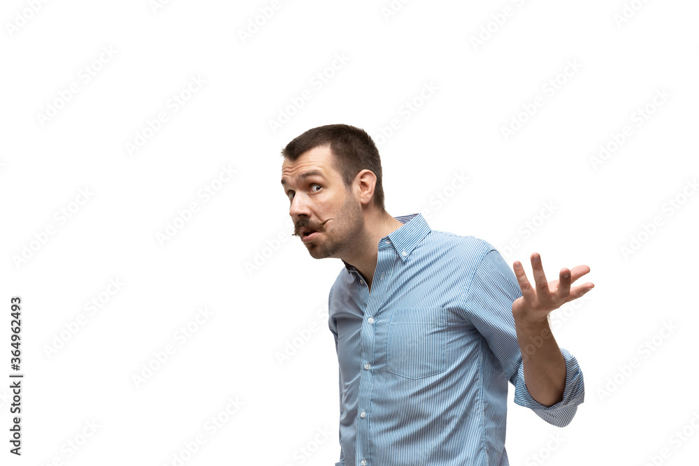 WHAT. Young caucasian man with funny, unusual popular emotions and gestures isolated on white studio background. Human emotions, facial expression, sales, ad concept. Trendy look inspired by memes.