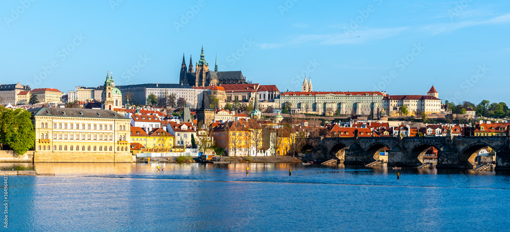Panoramic view of Prague Castle and Charles Bridge on sunny spring morning, Praha, Czech Republic