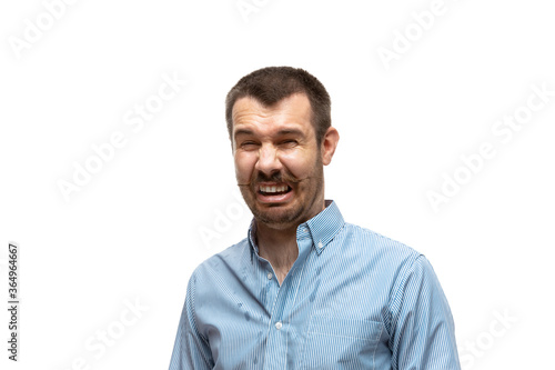Disguasting. Young man with funny, unusual popular emotions and gestures isolated on white studio background. Human emotions, facial expression, sales, ad concept. Trendy look inspired by memes. © master1305