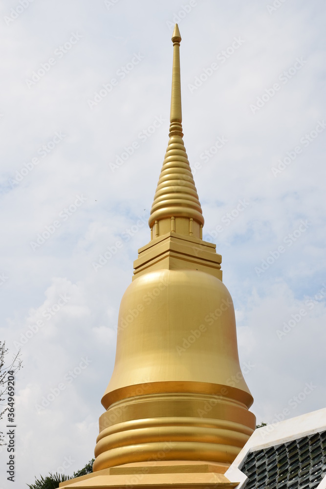 Golden pagodas on the sky background