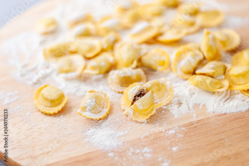Italian pasta preparation, agnolotti with flour and eggs stuffed with meat, typical Italian food