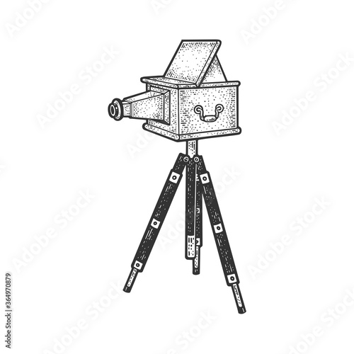 Old photo camera sketch engraving vector illustration. T-shirt apparel print design. Scratch board imitation. Black and white hand drawn image.