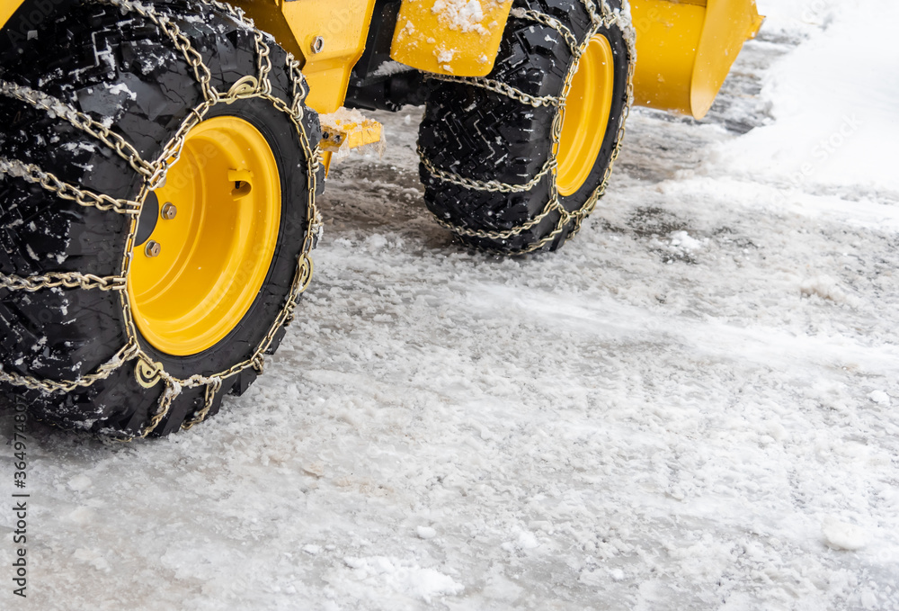 Chain wrap on the tractor wheel on the winter. Chain wrap on the tractor wheel on the winter.
