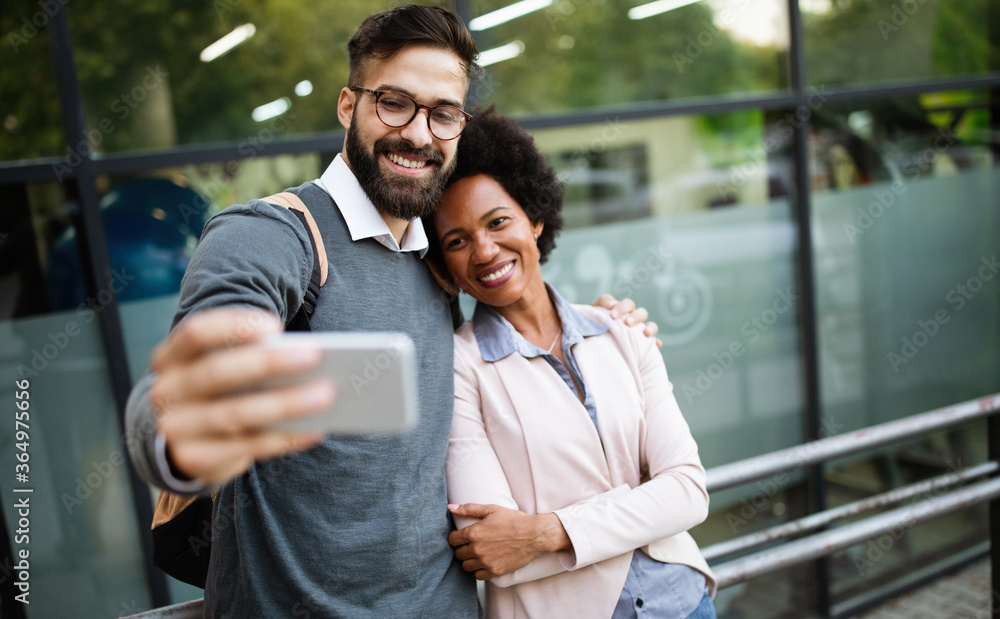 Happy loving couple. Happy young man and woman having fun together in city Happy loving couple. Happy young man and woman having fun together in city